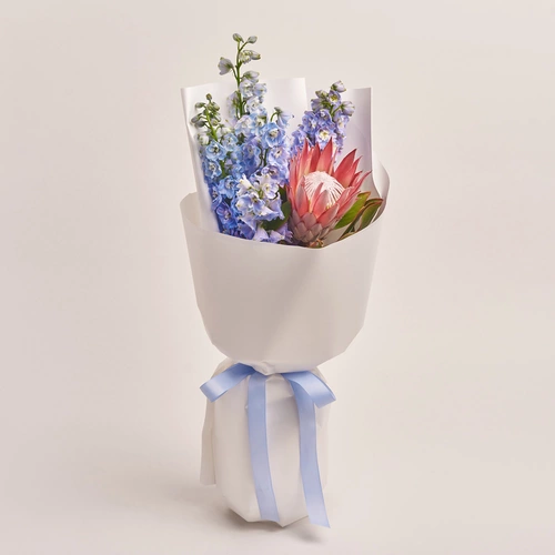 Product image Bouquet of 1 Protea аnd Delphiniums, packaging: White, vendor code: 3498